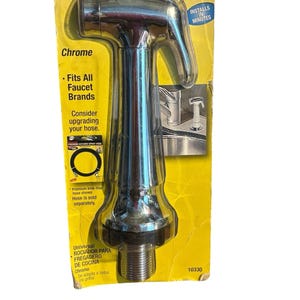 May include: A chrome universal kitchen sink spray nozzle packaged on a yellow cardboard backing. The packaging features the text Universal KITCHEN SINK SPRAY, Chrome, Fits All Faucet Brands, and notes that the hose is sold separately.