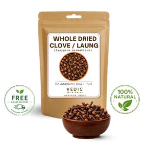 May include: A tan pouch labeled WHOLE DRIED CLOVE / LAUNG (Syzygium aromaticum) with the text No Additives | Raw + Pure, VEDIC Wild Herbs, HARYANA, INDIA. A dark brown wooden bowl filled with whole dried cloves sits in front of the pouch.