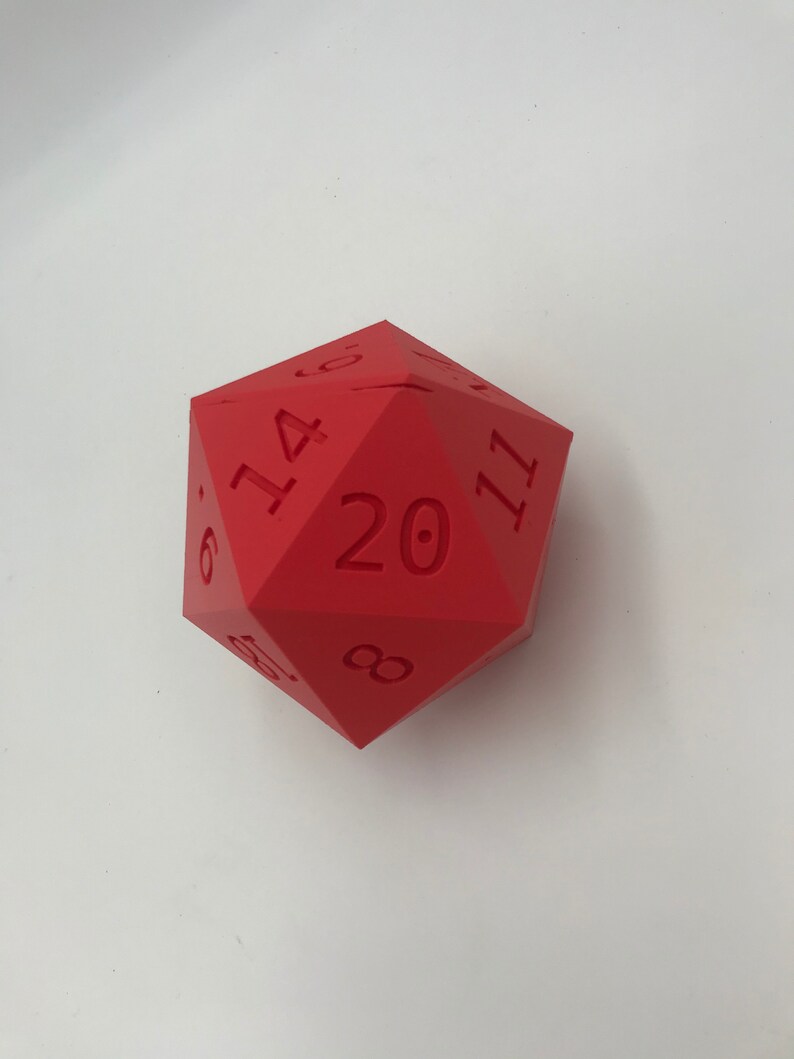 May include: A red twenty-sided die with numbers 6, 14, 20, and 11 visible.
