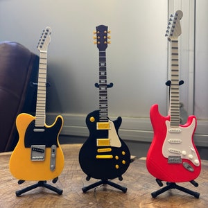 Pen voor elektrische gitaar met standaard: rock-'n-roll