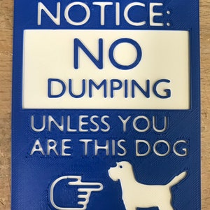 May include: Blue and white sign with the text "NOTICE: NO DUMPING UNLESS YOU ARE THIS DOG" with a white silhouette of a dog and a pointing hand.