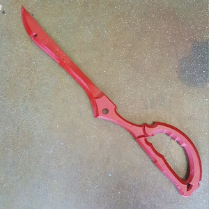 May include: A red plastic prop scissor with a detailed handle. The scissor is a replica of a popular anime weapon.