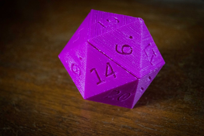 May include: A purple 20-sided die with the numbers 14, 6, 19, and 20 visible.