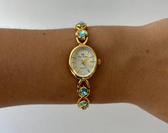 Vintage blauwe diamant gouden dameshorloge met kleine wijzerplaat