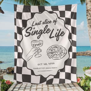 May include: A rectangular tapestry featuring a black and white checkered pattern. In the center, a scalloped white emblem displays the text "Last slice of Single Life," a line drawing of a hand holding a cocktail glass, a pizza, and "OCT 28, 2026 CHARLOTTE'S BACH PARTY."