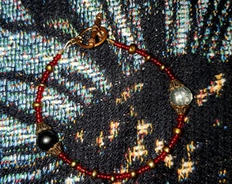 Pulsera roja Yin y Yang en bronce
