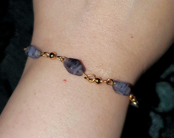 Pulsera de diamantes morados y dorados