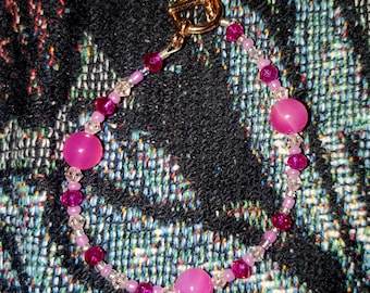 Pulsera de cristal rosa fucsia