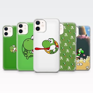 May include: Five phone cases featuring Yoshi from the Super Mario video game series. The cases display various designs, including Yoshi's face, a full body pose, and pixelated graphics. The cases are green and white.