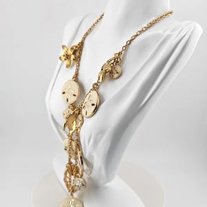 May include: A set of three ceramic vases in varying heights. The vases are white with a textured, ribbed design. The tallest vase is approximately 10 inches tall, the medium vase is 8 inches, and the smallest is 6 inches.