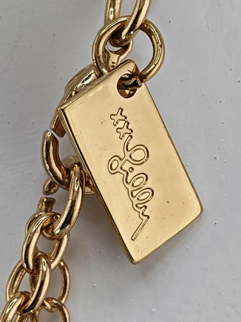 May include: A set of three ceramic mugs with a speckled, matte finish. The mugs are in shades of cream, light brown, and dark brown. Each mug has a simple, minimalist design, perfect for coffee or tea.