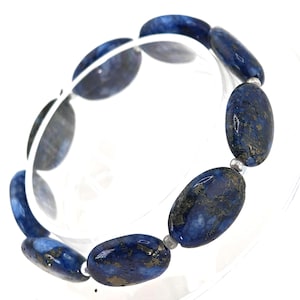 May include: A rustic wooden sign with the text "Welcome to our home" in white lettering. The sign features a distressed finish and a simple, inviting design, perfect for a front porch or entryway.