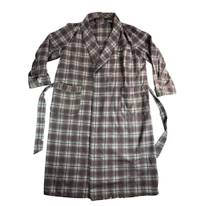 May include: A long-sleeved robe featuring a plaid pattern in shades of gray, white, and dark red. The garment includes a shawl collar, two large front patch pockets, a matching fabric tie belt, and buttoned cuffs on the sleeves for a classic look.