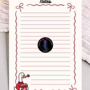 May include: A cream-coloured notepad with a red border and bows, featuring the word "Notes" at the top. A cartoon goose wearing a red sweater and holding a heart-shaped box and a rose is at the bottom. A circular logo with a peacock feather is in the centre.