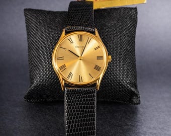 Rare montre à remontage manuel Movado pour homme des années 1980 - Cadran romain doré soleillé 32 mm