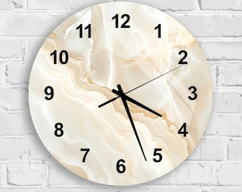 May include: Round wall clock with a cream and beige marble design. The clock face features black numerals and hands. The clock is mounted on a white brick wall.