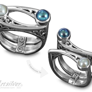 Puede incluir: Un anillo de plata con dos perlas, una blanca y una azul, engastadas en un delicado diseño de filigrana. El anillo es ajustable y se puede llevar de dos maneras diferentes, como se muestra en la imagen. El texto "Transforms To" es visible en la imagen.