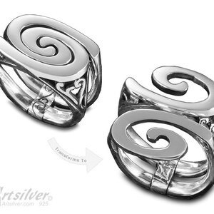 May include: Two silver rings with a spiral design. The rings are open and can be worn in two different ways. The rings are made of 925 sterling silver.