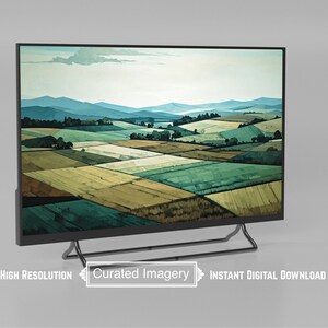 May include: A digital art print displayed on a black flat-screen TV. The artwork depicts a landscape of rolling hills and fields in shades of green, yellow, and brown, with blue mountains in the background. The TV has a black stand. Text on the screen reads "Curated Imagery".