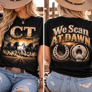 May include: A black t-shirt featuring a graphic print. The front displays the letters CT above a herd of running horses under a sunrise. The back shows the text We Scan AT DAWN with a horseshoe and a medical MRI scanner machine graphic.