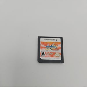 May include: A Nintendo DS game cartridge featuring the game "Mega Man Star Force 2". The cartridge has a black frame and a colorful game label with the game title and the "E" rating logo.