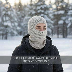 May include: A light gray crocheted balaclava, covering the head and neck, with an opening for the eyes. The balaclava is worn by a person in a black jacket, with a snowy forest background. Text on the image reads: CROCHET BALACLAVA PATTERN PDF INSTANT DOWNLOAD.