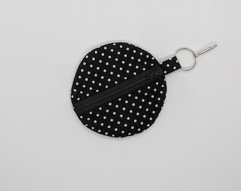 Pochette pour écouteurs noire et blanche à pois