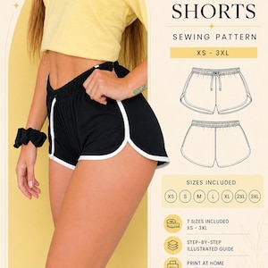 May include: A digital PDF sewing pattern for dolphin shorts in sizes XS to 3XL. The image displays black shorts with white trim, a yellow top, and technical line drawings of the shorts. Text includes DOLPHIN SHORTS, SEWING PATTERN, and SIZES INCLUDED.