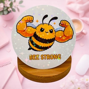 Sticker holographique abeille Be Strong – Autocollant motivation rond 6 cm – Waterproof – Vinyle résistant – Ordinateur, gourde, carnet
