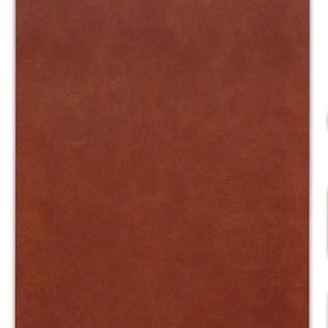 May include: A rectangular sheet of material with a solid, deep terracotta-brown color. The surface features a subtle, fine-grained texture that mimics the appearance of natural leather, displaying slight variations in tone across the flat surface.