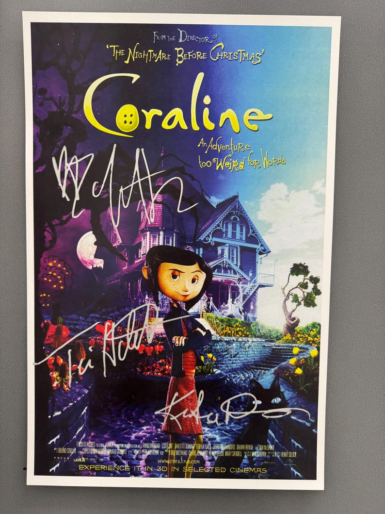 May include: A Coraline movie poster with a purple and blue background. The title "Coraline" is in yellow, with the tagline "An Adventure too Weird for Words." The poster features the character Coraline and several signatures.