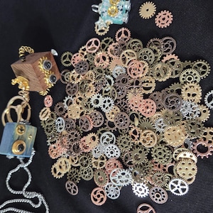 May include: A set of three ceramic mugs with a speckled, matte finish. The mugs are in shades of cream, light gray, and dark gray. Each mug has a simple, minimalist design and a rounded handle.