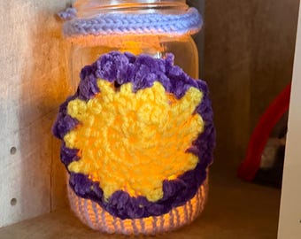 Battery operated plastic lantern with crochet cover and tangled accents