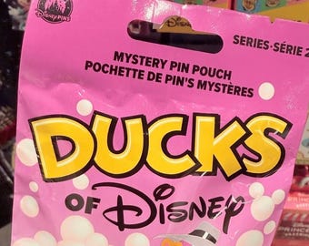 Sealed Disney duck wave 2 mystery bag containing 5 random Disney trading duck pins