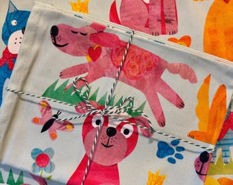 Dogs on the run Tea Towel