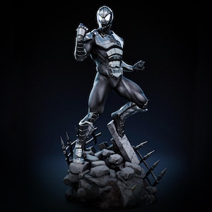 May include: A detailed statue of a superhero in a black and silver suit, posed dynamically on a rocky base. The figure has a textured design and is set against a dark background, highlighting the intricate details of the costume.