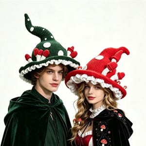 May include: Two crochet hats shaped like pointed mushrooms, one in dark green and one in bright red. Both hats feature white polka dots, a ruffled white brim, and small three-dimensional mushroom accents attached to the exterior surface.