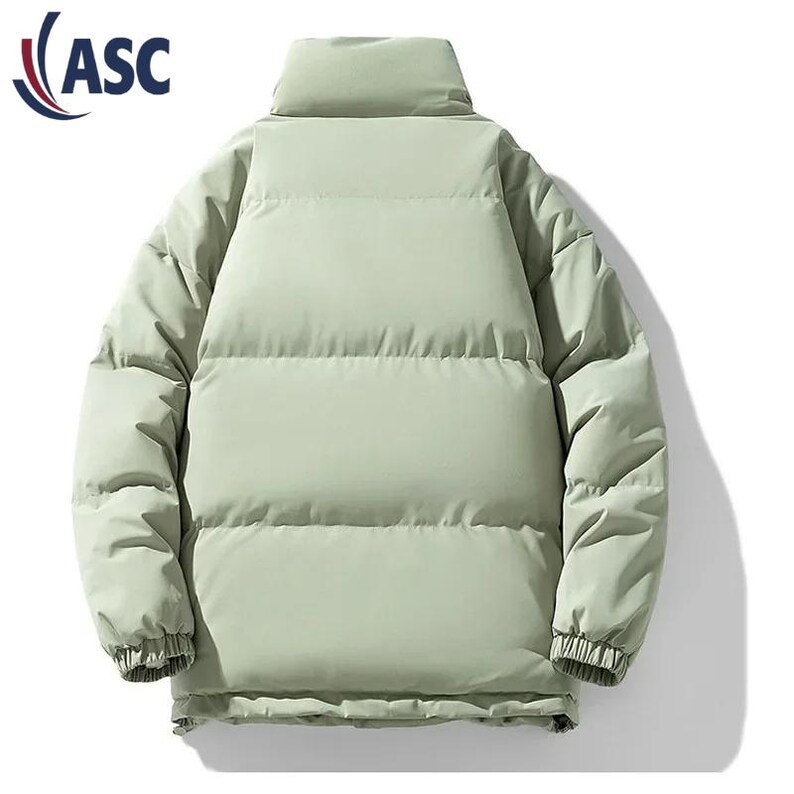 May include: A light green puffer jacket with a high collar. The jacket has a quilted design and ribbed cuffs. The logo "ASC" is visible in the upper left corner. This winter coat is designed for warmth and style.