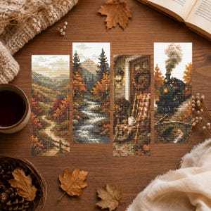 May include: Four rectangular cross-stitch bookmarks featuring autumn scenes: a winding path through hills, a mountain stream surrounded by trees, a cozy porch with a rocking chair, and a steam locomotive traveling through a forest with fall foliage.