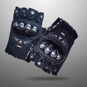 May include: Black fingerless gloves with silver knuckle protectors and red stitching. The gloves have the brand name "VOITZ" printed on them. These gloves are designed for protection and grip.