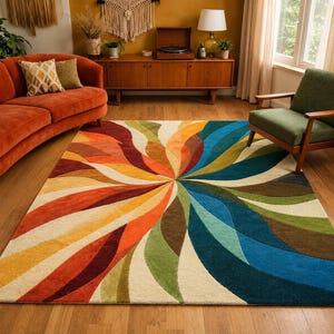 May include: A rectangular area rug featuring a large, swirling radial pattern of curved, petal-like shapes in vibrant shades of orange, yellow, cream, olive green, brown, and deep blue, radiating from a central point across the floor.