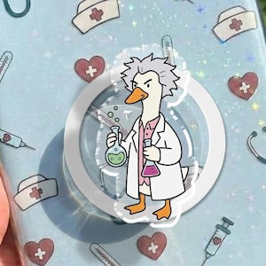 May include: A light blue tablet case with a clear border, decorated with medical-themed icons and a cartoon goose wearing a lab coat. The case features stethoscopes, syringes, hearts, and nurse hats.