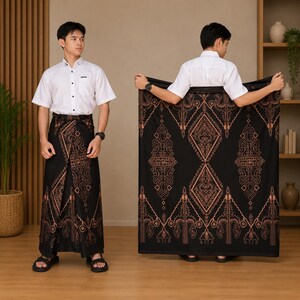 May include: A white short-sleeved button-down shirt paired with a black sarong featuring a copper-coloured geometric and floral pattern. The sarong is displayed both wrapped around the waist and held open to show the full length of the fabric design.