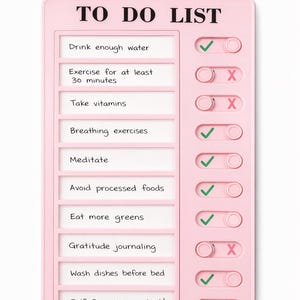 May include: A rectangular light pink plastic to-do list board with a white insert featuring black text. The list includes tasks like Drink enough water, Exercise, Take vitamins, Breathing exercises, Meditate, Avoid processed foods, and more.