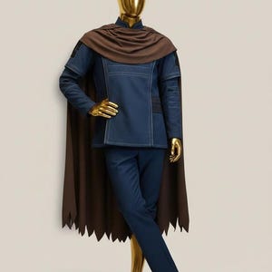 May include: A white ceramic mug with a black handle and the text "But First, Coffee" in a handwritten style. The mug is on a white surface. The mug is 4 inches tall.