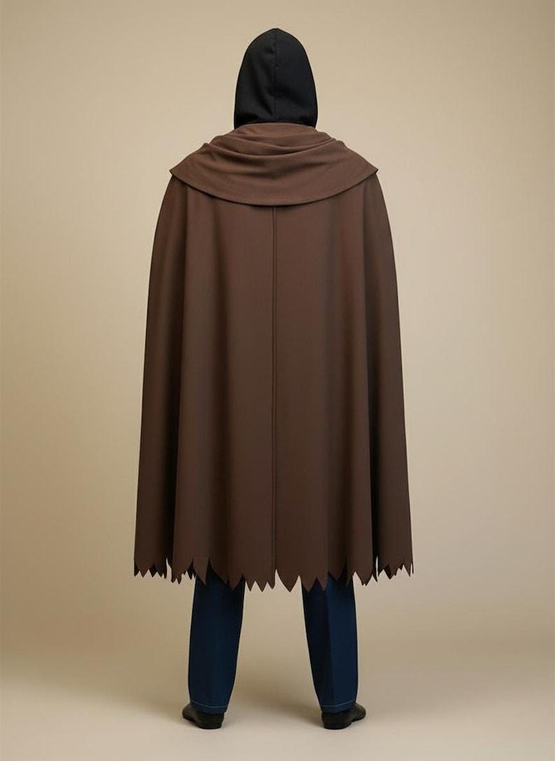 May include: A white ceramic mug with a black handle and the text "But First, Coffee" in a bold, black font. The mug is set against a neutral background, highlighting its simple design.