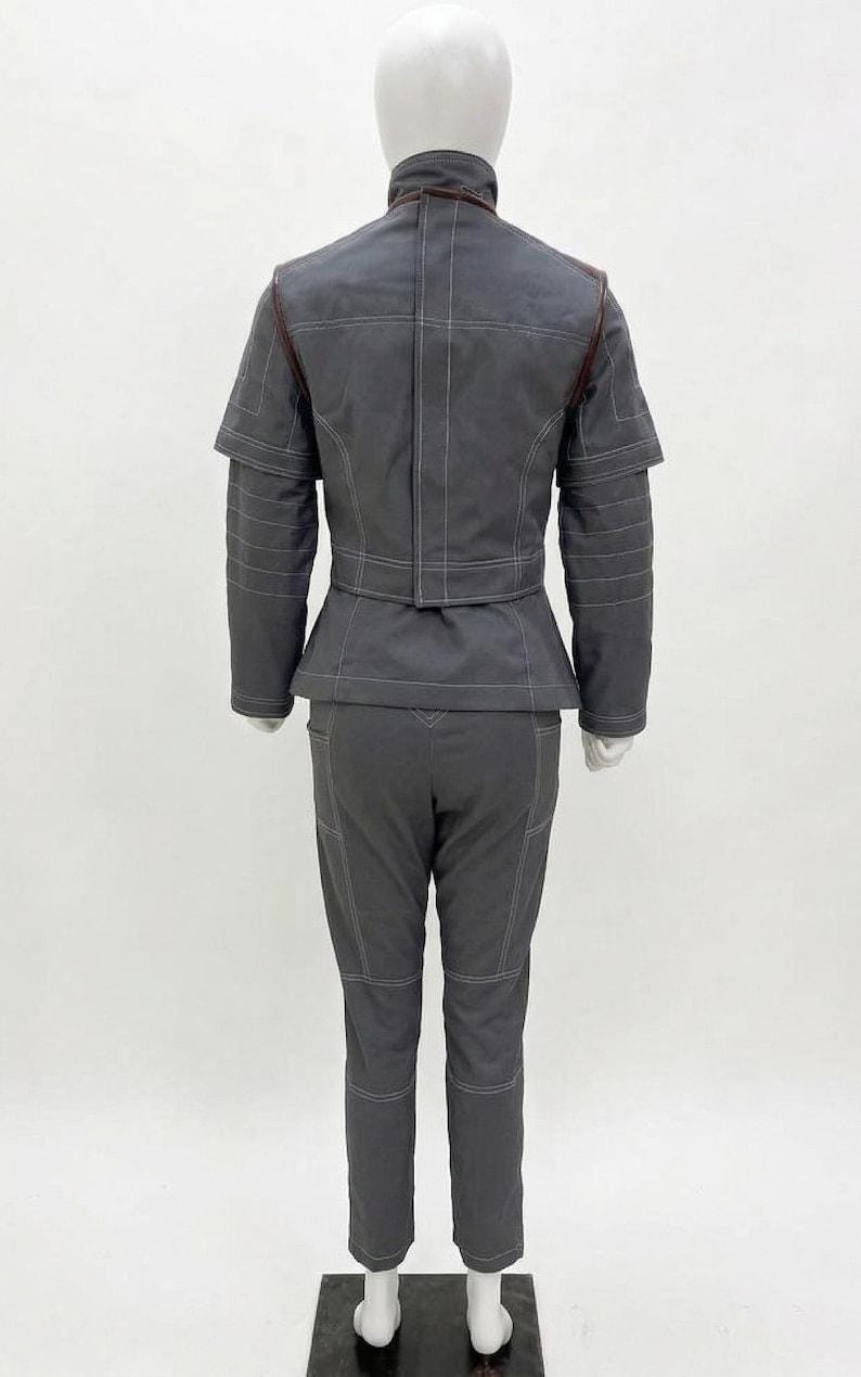 May include: A set of three ceramic mugs with a speckled, matte finish. The mugs are in shades of cream, light gray, and dark gray. Each mug has a simple, minimalist design, perfect for coffee or tea.