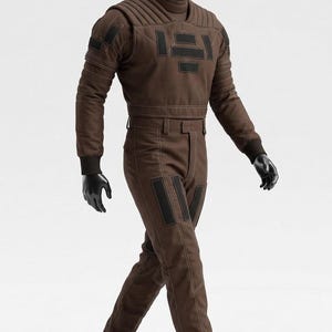 May include: A brown jumpsuit with black accents, displayed on a mannequin. The outfit features a high collar, quilted detailing on the shoulders and chest, and black rectangular patches. The mannequin wears black gloves and white socks.