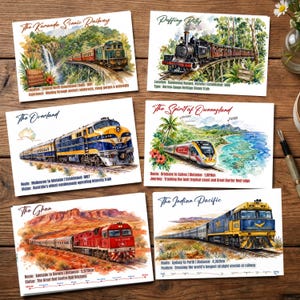 May include: Six rectangular postcards featuring watercolor illustrations of Australian trains: The Kuranda Scenic Railway, Puffing Billy, The Overland, The Spirit of Queensland, The Ghan, and The Indian Pacific, each with descriptive text and route details.