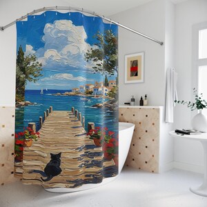 May include: A shower curtain featuring an oil painting style landscape of a wooden pier extending into a blue sea. A black cat sits on the pier near potted red flowers. The scene includes a coastal village, sailboats, and a bright blue sky.